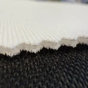Close-up of HQ+ Deluxe polyester golf impact screen material showing the fabric texture